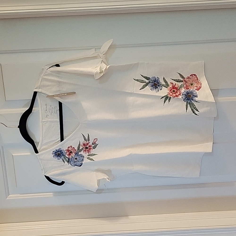 Chicos white shirt with floral embellishments and split shoulder medium